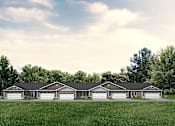 Thumbnail 9 of 9 - A row of houses with garages in front of them.
