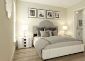Thumbnail 8 of 9 - A bedroom with a large bed and a nightstand with a lamp.