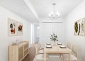 Thumbnail 2 of 33 - A dining room with a wooden table set for four.