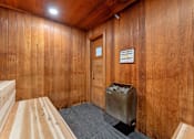 Thumbnail 15 of 29 - A room with wooden walls and a door.