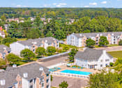 Thumbnail 24 of 29 - A bird's eye view of a resort with a swimming pool.