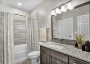 Thumbnail 4 of 32 - a bathroom with a sink and a toilet and a shower