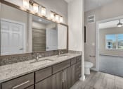 Thumbnail 14 of 32 - a bathroom with two sinks and a large mirror