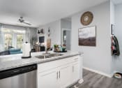 Thumbnail 7 of 30 - a kitchen with a counter top and a sink