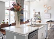 Thumbnail 14 of 30 - a kitchen with a counter top and a sink