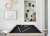 Thumbnail 18 of 30 - a pool table in the living room of a home