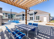 Thumbnail 28 of 30 - our apartments have a large patio with chairs and tables