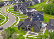 Thumbnail 28 of 30 - an aerial view of a neighborhood with rows of houses