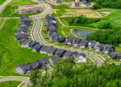 Thumbnail 29 of 30 - an aerial view of a neighborhood with rows of houses