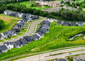 Thumbnail 30 of 30 - an aerial view of a neighborhood with rows of houses