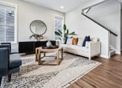 Thumbnail 5 of 30 - a living room with a couch and a table