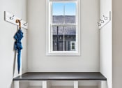 Thumbnail 12 of 30 - a room with white shelves and a window with a view of a building