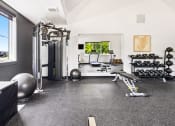 Thumbnail 19 of 30 - the home gym has plenty of equipment and a large window