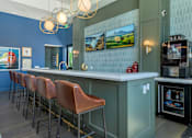 Thumbnail 25 of 43 - A row of brown leather bar stools are in front of a bar.