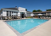 Thumbnail 38 of 43 - A large swimming pool in front of a white building.