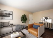 Thumbnail 2 of 10 - a living room with a couch and a chair