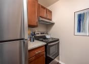 Thumbnail 3 of 10 - our apartments have a modern kitchen with stainless steel appliances