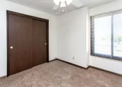 Thumbnail 24 of 30 - an empty bedroom with a closet and a window