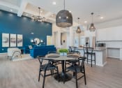 Thumbnail 15 of 30 - clubhouse with community kitchen dining table and blue sofa