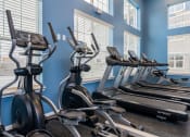 Thumbnail 11 of 30 - fitness center with elliptical machines and treadmills