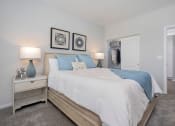 Thumbnail 6 of 30 - a bedroom with a bed and a closet