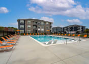 Thumbnail 21 of 30 - our apartments feature a swimming pool with lounge chairs
