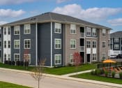Thumbnail 26 of 30 - an apartment building on the side of a street