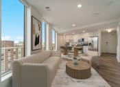 Thumbnail 7 of 29 - a living room with a couch and a table