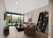 Thumbnail 3 of 38 - a living room with a couch and a coffee table