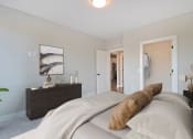 Thumbnail 6 of 38 - a bedroom with a large bed and a closet