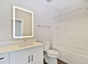 Thumbnail 19 of 38 - a bathroom with a sink toilet and a shower