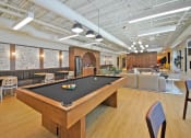 Thumbnail 22 of 38 - a game room with a pool table