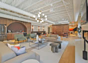 Thumbnail 1 of 38 - a living room with couches and chairs and a table