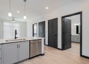 Thumbnail 10 of 29 - a kitchen with a sink and a counter top