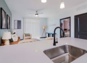 Thumbnail 4 of 29 - kitchen sink and living room