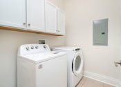 Thumbnail 27 of 40 - a washer and dryer in a laundry room