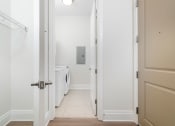 Thumbnail 26 of 40 - a laundry room with a washer and dryer in a 555 waverly unit