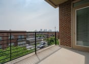 Thumbnail 30 of 40 - a balcony with a view of the city