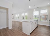 Thumbnail 19 of 40 - a kitchen and dining area in a 555 waverly unit