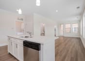 Thumbnail 18 of 40 - a kitchen and living room in a 555 waverly unit