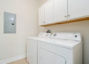 Thumbnail 14 of 40 - a washer and dryer in a laundry room