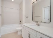 Thumbnail 12 of 40 - a bathroom with a sink toilet and bathtub