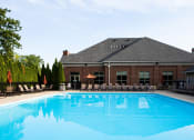 Thumbnail 36 of 40 - harrison park apartments outdoor pool with lounge chairs