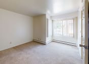 Thumbnail 12 of 29 - an empty room with a window and a door