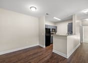 Thumbnail 2 of 42 - A kitchen area with a counter and cabinets.