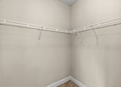 Thumbnail 11 of 42 - Empty white closet with a white shelf.