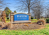 Thumbnail 42 of 42 - A sign that says Haven Cross Creek in front of a tree.
