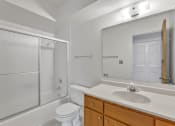 Thumbnail 25 of 38 - a bathroom with a sink toilet and shower