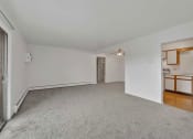 Thumbnail 20 of 38 - a bedroom with white walls and carpet