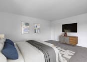 Thumbnail 13 of 38 - a bedroom with a large bed and a tv on the wall